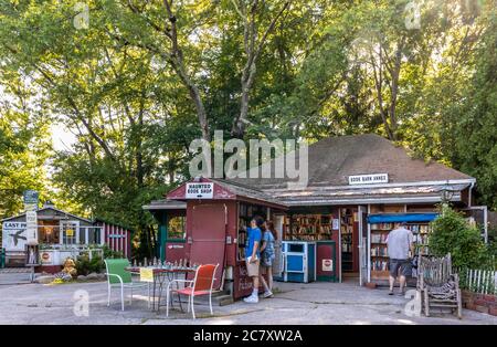 Niantic Connecticut - June 17, 2020: Book Barn in Niantic Connecticut, beautiful outdoor used bookstore. People shopping books. Stock Photo