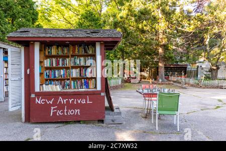 Niantic Connecticut - June 17, 2020: Book Barn in Niantic Connecticut, beautiful outdoor used bookstore. People shopping books. Stock Photo