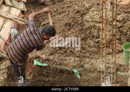 Kolkata, West Bengal/India - July, 2020:  Migrant and local labourers are working for construction industry at Barasat, N.24 Parganas. Stock Photo
