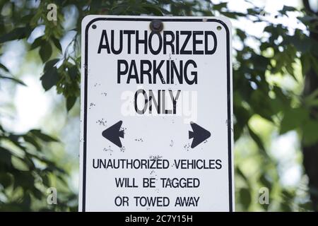 An old Authorized Parking Only sign seen in the city Stock Photo