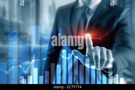 Businessman drawing graph with marker on media screen. Stock Photo