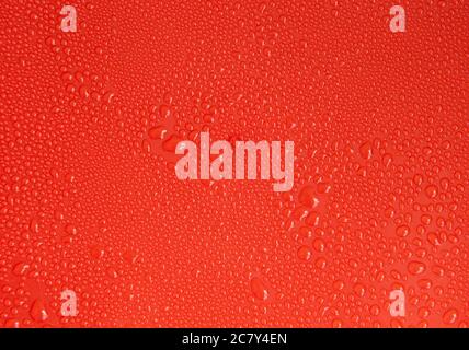 Water on a red background. Abstract painting or blank for design. Stock Photo
