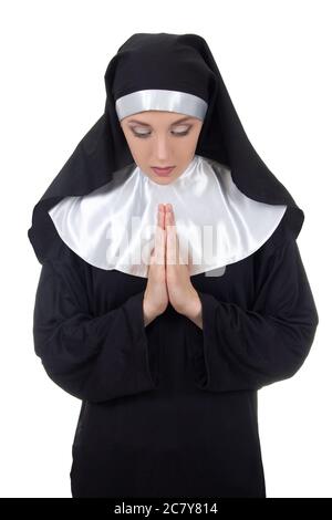 young woman nun praying isolated on white background Stock Photo