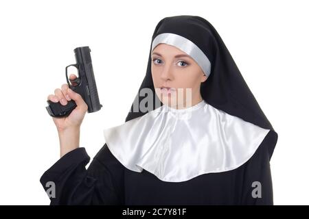 young woman nun with gun isolated on white background Stock Photo