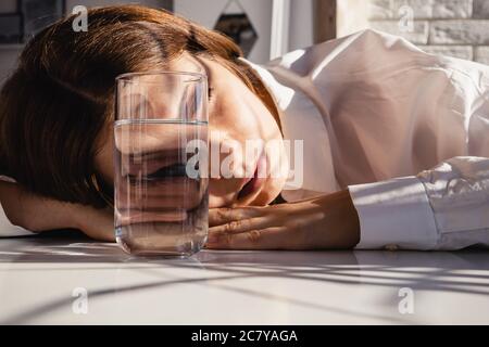 Fashion woman portrait, eye looks through the glass of water. Stock Photo