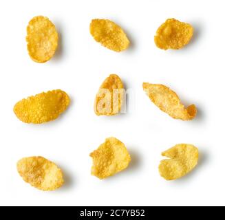 golden corn flakes macro isolated on white background, top view Stock Photo