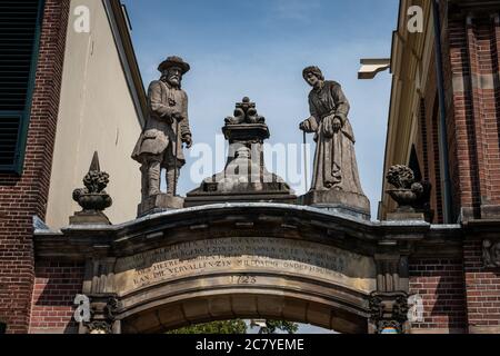 Sculptures above a gate in the hanseatic city of Zutphen in the Netherlands, province of Gelderland Stock Photo