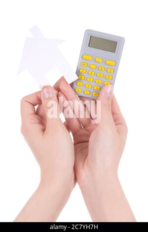 woman hands holding pocket calculator and paper house isolated on white background Stock Photo