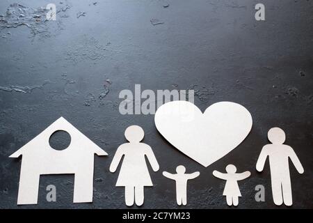 paper family on a black background with space for text Stock Photo