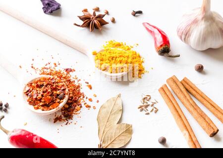multi-colored spices and herbs on white background close-up Stock Photo