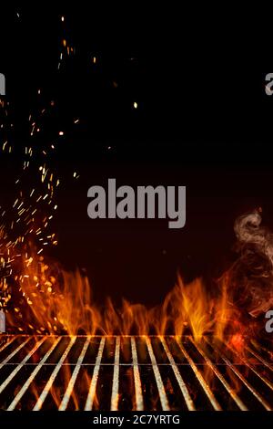 Empty steel barbecue BBQ grill grate with flaming fire, sparks and smoke on black  background. Cooking concept. Close up, copy space Stock Photo - Alamy