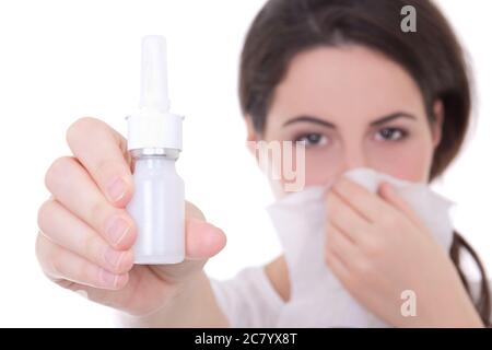 attractive young woman holding nasal spray isolated on white background Stock Photo