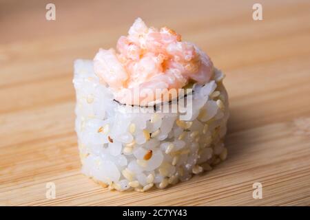 close up of sushi with shrimps on wooden desk Stock Photo