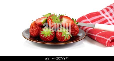 Stawberries, towel and knife on white background. Stock Photo
