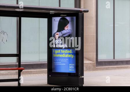 Government sponsored covid-19 coronavirus safety advert for testing on a bus stop, Westminster, London, England, UK Stock Photo
