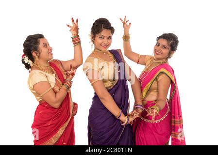 traditional beautiful indian young girls in saree posing on white background 2c801tn