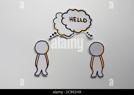 Paper figures with speech bubbles on the white Stock Photo