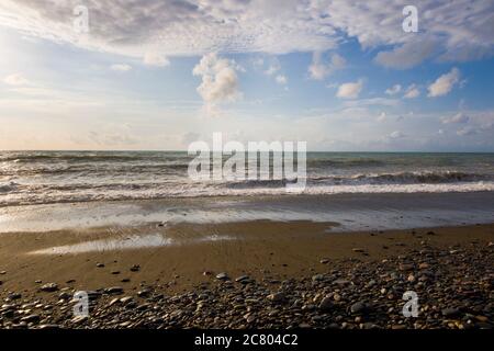 Stormy weather, waves and splashes in Batumi, Georgia. Stormy Black sea. Water background. Stock Photo