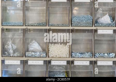 Screws bolts and nuts used in an electrics repairs workshop Stock Photo