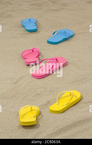 Colorful pairs of female flip flops on white background Stock Photo - Alamy
