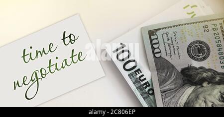 Card with text Time To Negotiate and money. Business concept Stock Photo