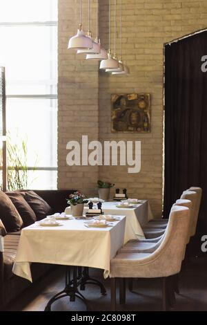 interior is loft style restaurant with its leather chairs Stock Photo
