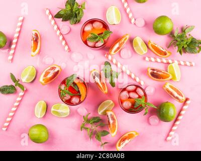 Summer pattern with citrus slices and red drink Stock Photo