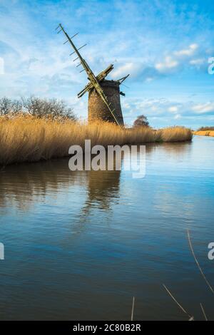 Windmill England, view of an abandoned windmill at Brograve drainage mill sited in a remote area of the Norfolk Broads near Horsey, east Norfolk, UK Stock Photo