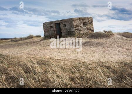 Pillbox UK, view of a derelict Type 24 WWll pillbox sited on dunes near Horsey on the East Norfolk coast, England, UK Stock Photo