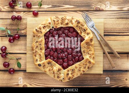 Flat lay of homemade cherry open pie galette Stock Photo