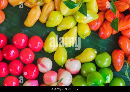 Colorful Traditional Thai desserts, called 'Luk Chup', one of the famous Thai desserts made from beans, coconut, and jelly. Stock Photo