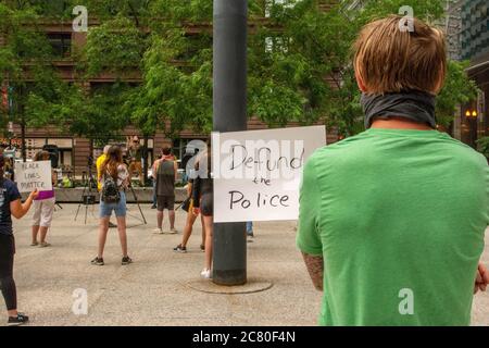 Chicago, IL, USA. 18th July, 2020. Protesters practice social distancing during while protesting a proposed civilian-led ICE academy in Chicago on July 18, 2020. Credit: Dominic Gwinn/ZUMA Wire/Alamy Live News Stock Photo