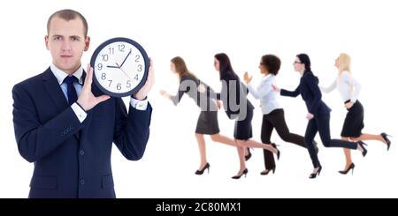deadline concept - young businessman holding office clock and running people isolated on white background