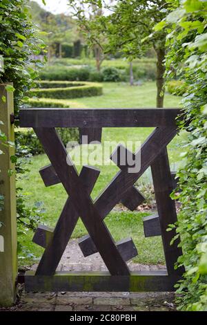 Contemporary wooden gate in the Walled Garden of the stately Regency home Scampston Hall in North Yorkshire Stock Photo