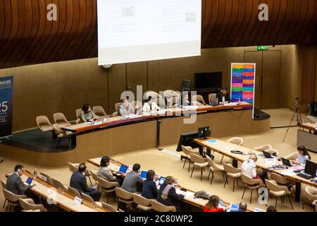 Interior, United Nations building, Geneva. Semi-circular debating room XVIII with presentation taking place and various nations delegates sitting. Stock Photo