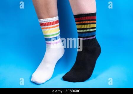 Concept photo of socks with rainbow colors, allegory Stock Photo