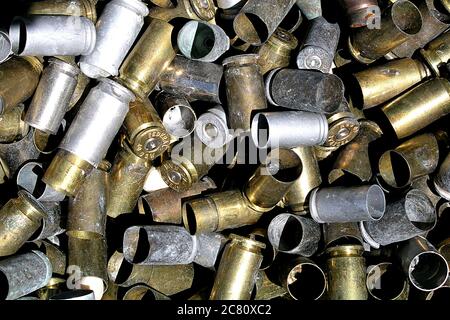 Empty ammo cartridges from bullets in a pile. Stock Photo