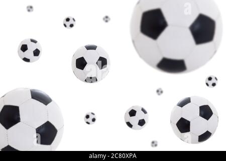 flying leather soccer balls isolated on white background Stock Photo