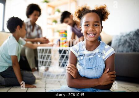 Happy black family playing game together at home Stock Photo