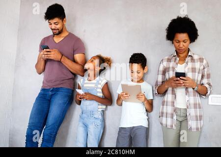 Family sharing there privacy data by using digital devices, phones, tablets Stock Photo