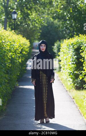 Muslim woman in full growth, urban lifestyle. Stock Photo