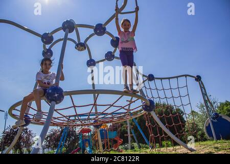 Teenage girl is playing at the playpen Stock Photo