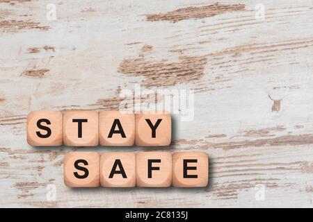 stay safe written on wooden cubes Stock Photo