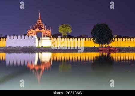 Royal palace illuminated at night in Mandalay Burma, Myanmar Stock Photo