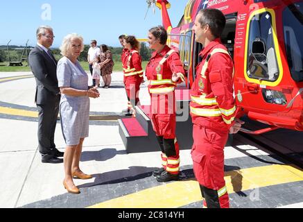 The Duchess of Cornwall speaks with air crew during a visit to Cornwall Air Ambulance Trust's base in Newquay to launch the new 'Duchess of Cornwall' helicopter, while on a three day visit to Cornwall with the The Prince of Wales. Stock Photo