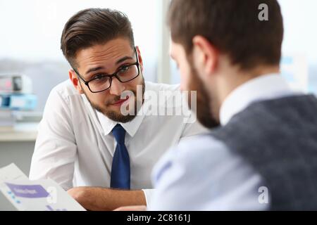Two managers discussing work matters in office Stock Photo