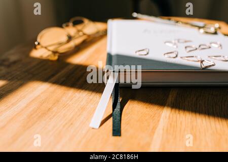 book mark ribbon of a journal on a table at home Stock Photo