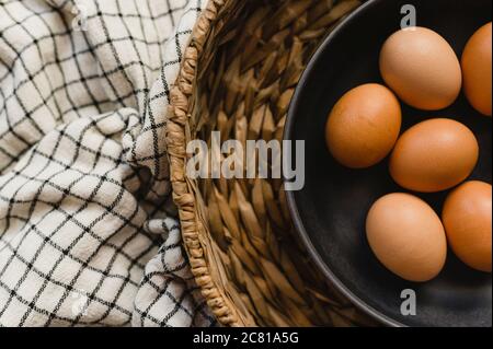 Organic Brown Eggs in Brown Bowl and Basket Stock Photo