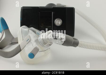 CPAP machine with adult full face mask for the treatment of sleep apnoea, UK unbranded with no logos or people, isolated on a white background Stock Photo