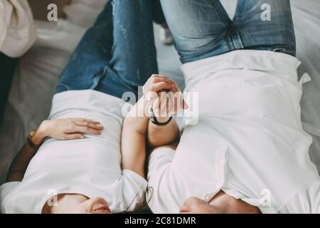 close up. happy young couple lying on the floor in the living room . Stock Photo